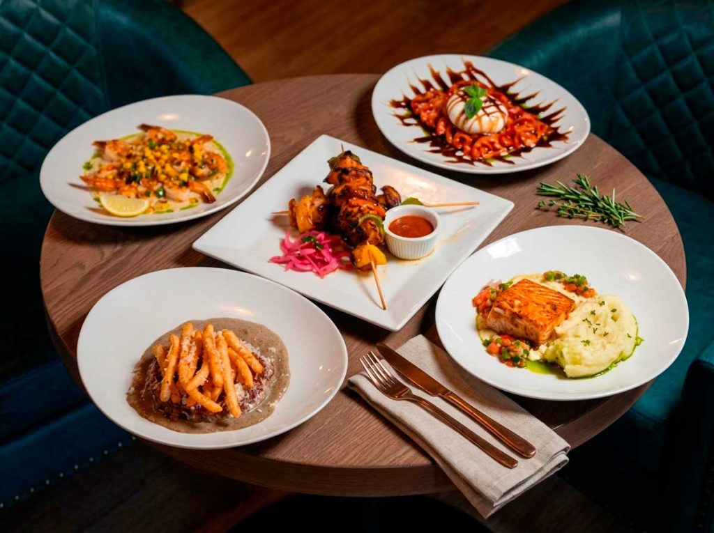 Assorted Mediterranean shareable plates and skewers at Mojo Hookah Lounge in Midtown Houston
